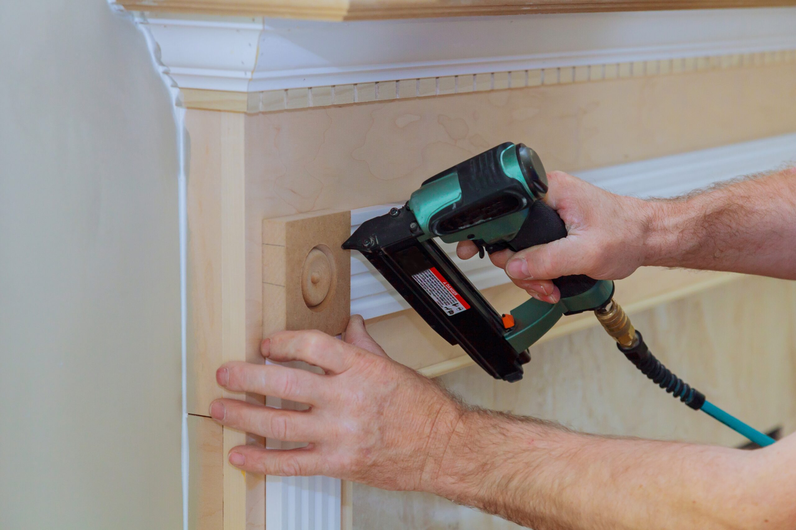 Fireplace with installation of moldings on fireplaces and white crown molding, no fire
